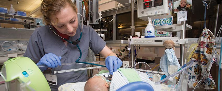 Nurse working with baby
